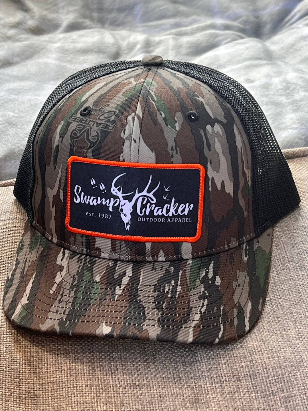 Camo Swamp Cracker Orange Logo Patch hat