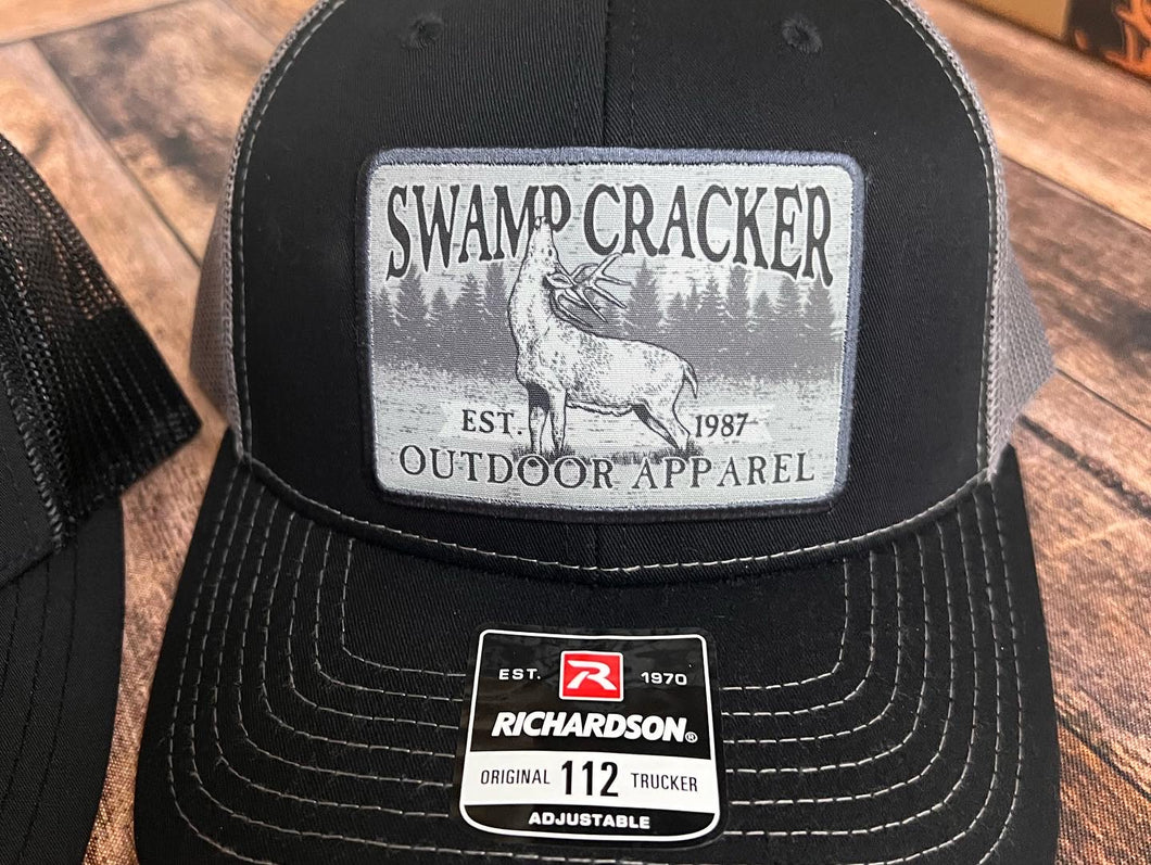 Swamp Cracker licking branch patch hat
